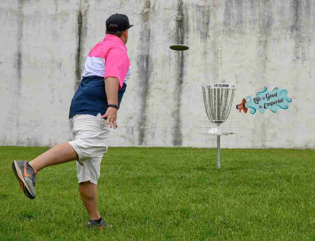 Disc golfing with a "Life is good in Emporia" mini-mural